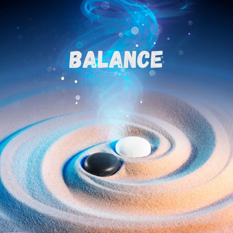 A spiral of sand with a black stone beside a white stone, and a swirl of blue smoke leading up from it. The word balance is above it
